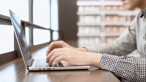 Asian university student man using laptop computer in college library Stock-Footage 90993496