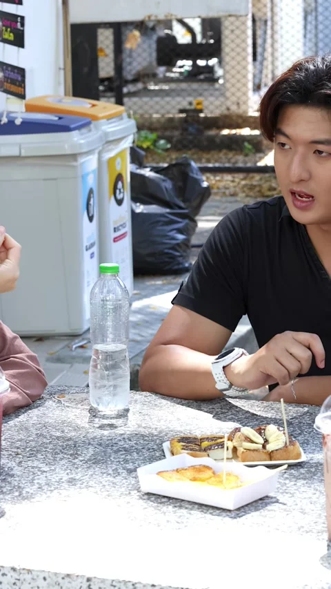 Asian University Students Talking and Eating Snacks at Outdoor Cafeteria Table Stock Footage 335500201