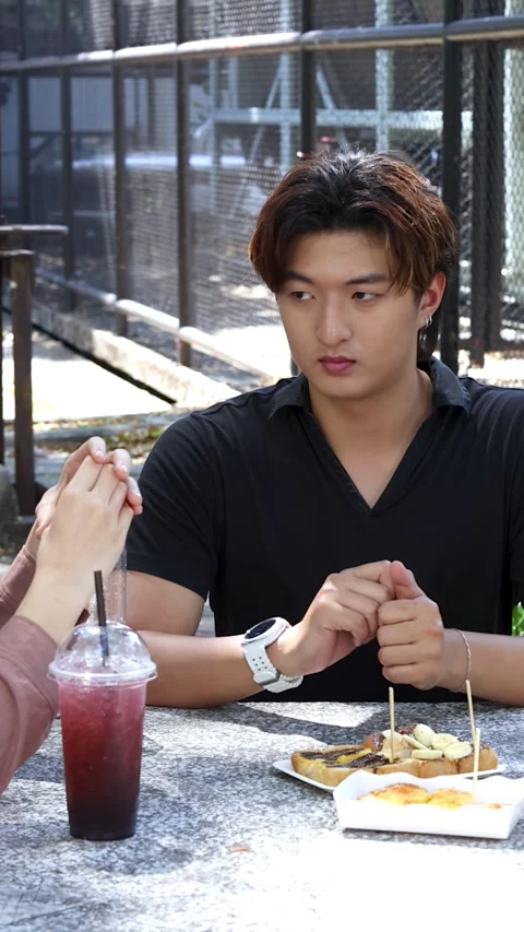 Asian University Students Talking and Eating Lunch at Outdoor Cafeteria Table Stock Footage 335500501