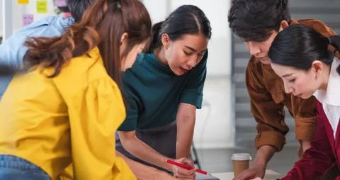 Asian ux developer and ui designer brainstorming about mobile app interface w Stock Photos