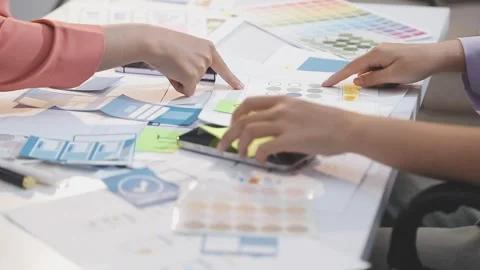 Asian uxui designer working on website design using sticky notes and wirefram Stock Footage 332275190