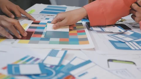 Asian uxui designer working on website design using sticky notes and wirefram Stock Footage 332275235