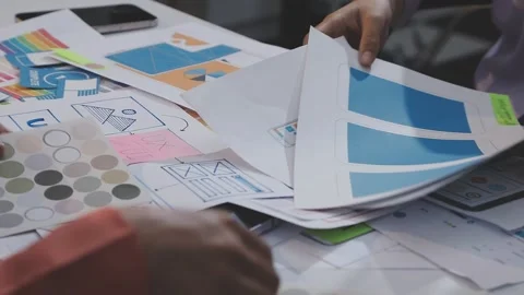 Asian uxui designer working on website design using sticky notes and wirefram Stock Footage 332275268