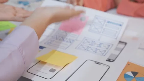 Asian uxui designer working on website design using sticky notes and wirefram Stock Footage 332275276