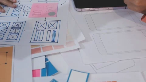 Asian uxui designer working on website design using sticky notes and wirefram Stock Footage 332275285