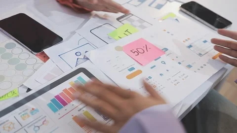 Asian uxui designer working on website design using sticky notes and wirefram Stock Footage 332275345