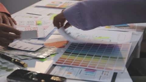 Asian uxui designer working on website design using sticky notes and wirefram Stock Footage 332275374