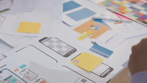 Asian uxui designer working on website design using sticky notes and wirefram Stock Footage 332275426