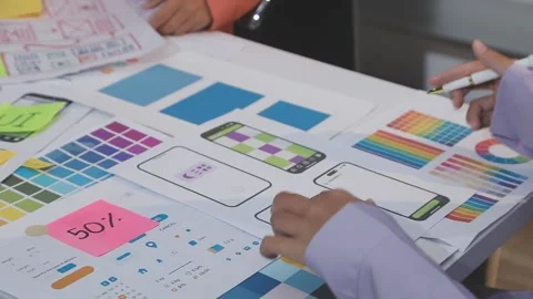 Asian uxui designer working on website design using sticky notes and wirefram Stock Footage 332275478