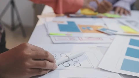 Asian uxui designer working on website design using sticky notes and wirefram Stock Footage 332275732