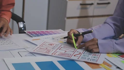 Asian uxui designer working on website design using sticky notes and wirefram Stock Footage 332275742