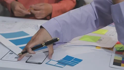 Asian uxui designer working on website design using sticky notes and wirefram Stock Footage 332275760