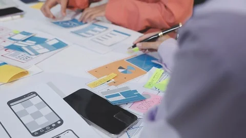 Asian uxui designer working on website design using sticky notes and wirefram Stock Footage 332275857