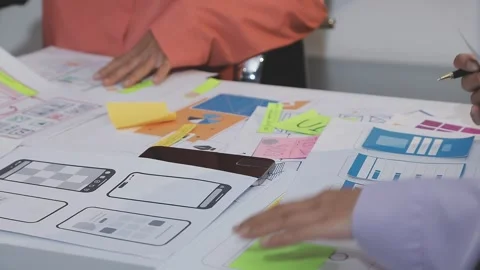Asian uxui designer working on website design using sticky notes and wirefram Stock Footage 332275960
