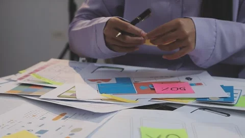 Asian uxui designer working on website design using sticky notes and wirefram Stock Footage 332276057