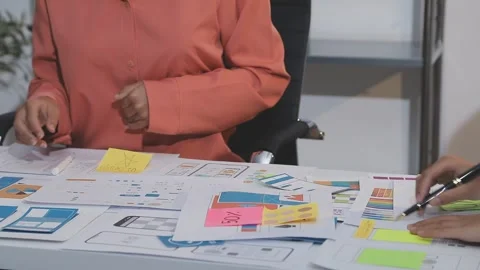Asian uxui designer working on website design using sticky notes and wirefram Stock Footage 332276108