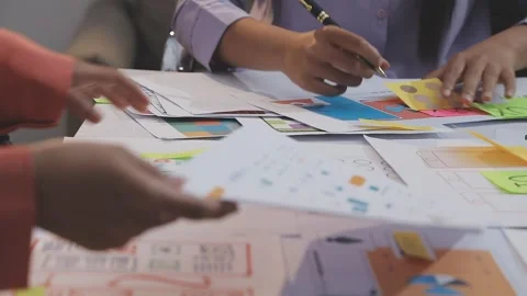 Asian uxui designer working on website design using sticky notes and wirefram Stock Footage 332276158