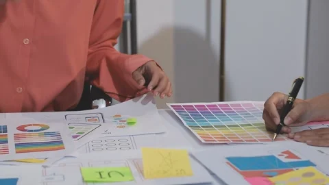 Asian uxui designer working on website design using sticky notes and wirefram Stock Footage 332276199