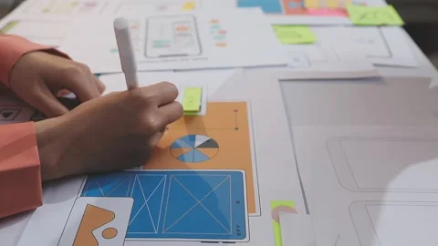 Asian uxui designer working on website design using sticky notes and wirefram Stock Footage 332276242