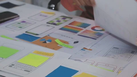Asian uxui designer working on website design using sticky notes and wirefram Stock Footage 332276282
