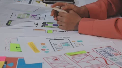 Asian uxui designer working on website design using sticky notes and wirefram Stock Footage 332276298
