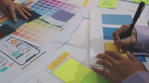 Asian uxui designer working on website design using sticky notes and wirefram Stock Footage 332276348