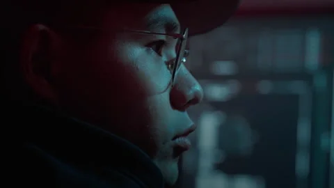 Asian virtual thief working on cyber crime at dark room Stock Footage 257383143