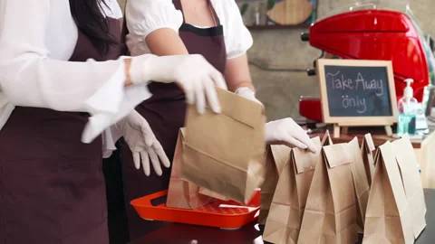 Asian Waitress Preparing order for take away customer.Slow motion Dolly shop Stock Footage 144390520