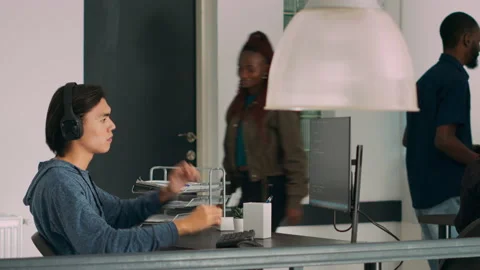 Asian web developer programming firewall server on terminal window Stock Footage 231448401