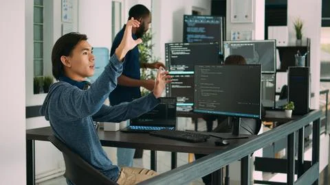 Asian web developer working with hologram and augmented reality Foto stock