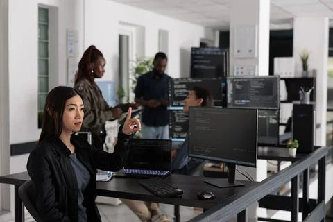 Asian web developer working with hologram and coding language Stock Photos