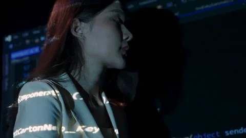 Asian woman analyzing coding Stock Footage 229583026