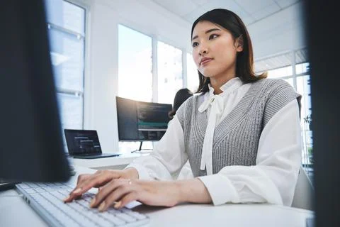 Asian woman, computer and coding in software development or web design at the Stock Photos