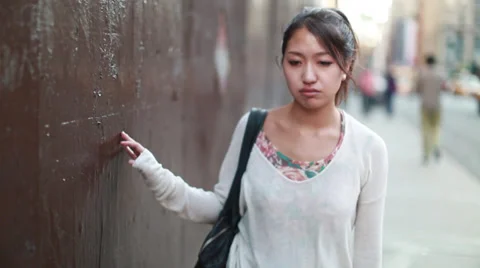 Asian woman depressed sad walking Stock Footage
