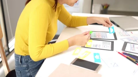 Asian Woman Designing User Interface for Mobile App on Desk | UI UX Design .. Stock Footage 333470366