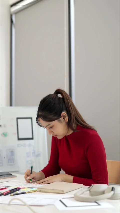 Asian Woman Designs User Interface UX on Paper for Mobile App Adult Profess.. Stock Footage 333470326