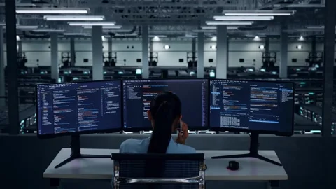 Asian Woman Developer Talking On Mobile Phone While Write Code In Data Center Stock Footage 270228915