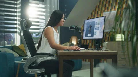 Asian woman developing cloth design on PC Video stock 211795158