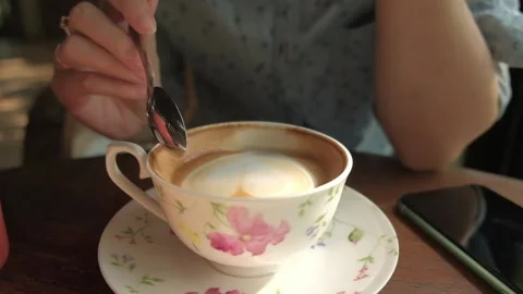 Asian woman drinking coffee or tea in cafe. Stock Footage 134732753