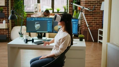 Asian woman engineer creates prototypes with vr glasses and 3D modeling software Stock Footage 319717892