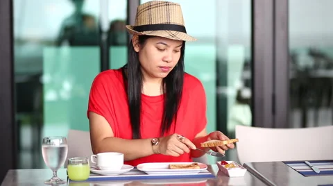 Asian woman having a breakfast at a restaurant Stock Footage 55644053