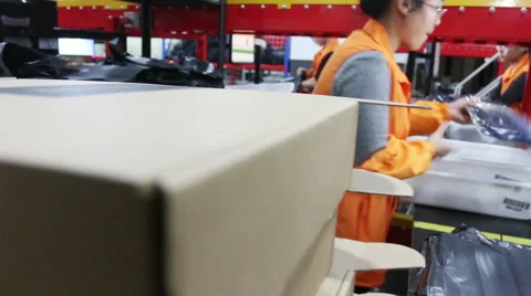 Asian woman packaging and  sorting  express delivery package Stock Footage 43945557