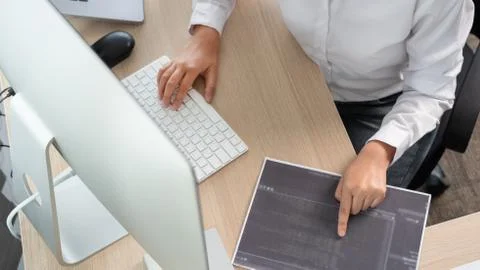 Asian Woman programmer typing source codes Programming On Computer in office, Foto stock