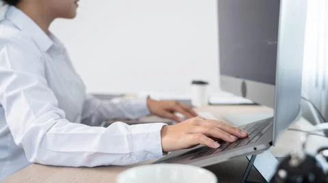 Asian Woman programmer typing source codes Programming On Computer in office, Foto stock