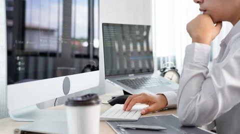 Asian Woman programmer typing source codes Programming On Computer in office, Foto stock