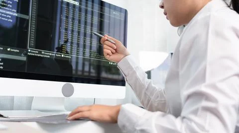 Asian Woman programmer typing source codes Programming On Computer in office, Foto stock