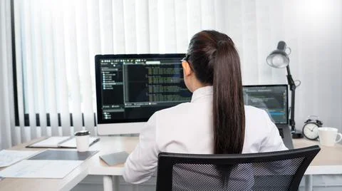 Asian Woman programmer typing source codes Programming On Computer in office, Stock Photos