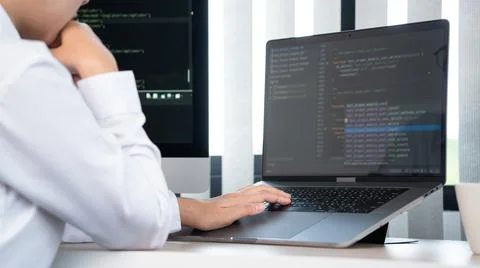 Asian Woman programmer typing source codes Programming On Computer in office, Foto stock