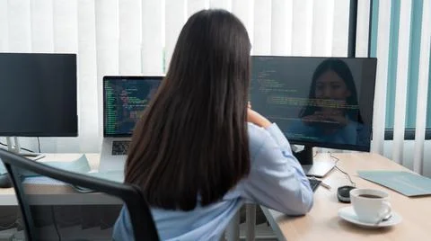 Asian woman programmer typing source code with computer pc for Developing pro Stock Photos