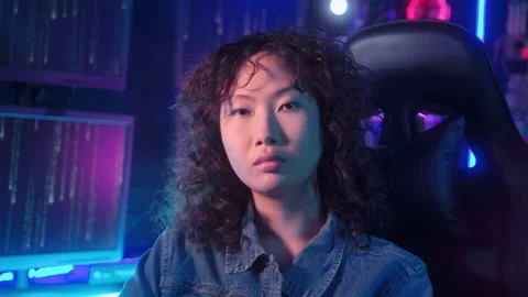 An asian woman programmer is working in her computer room , futuristic tech.. Stock Footage 232945858
